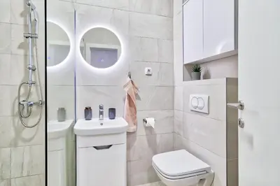 a bathroom with a toilet and a sink and a shower at GOLDENBOY apartments, Banja Luka in Banja Luka