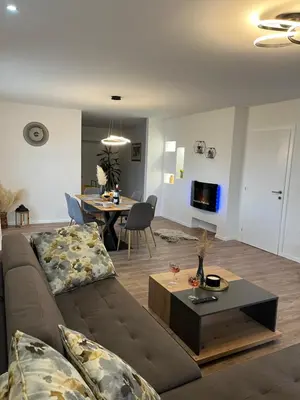 a living room with a couch and a table at Apartment Lux Lucis in Livno