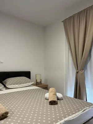 a bedroom with two beds with towels on them at Apartment Lux Lucis in Livno