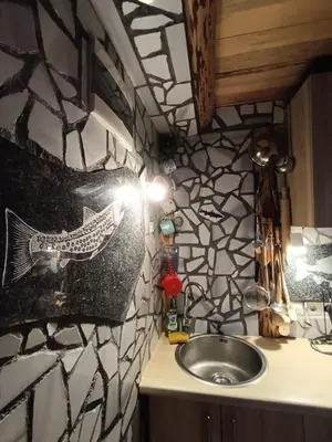 a bathroom with a sink and a stone wall at Jajce lake cottage-Plivsko jezero in Jajce