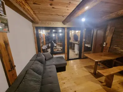 a living room with a couch and a table at Jajce lake cottage-Plivsko jezero in Jajce