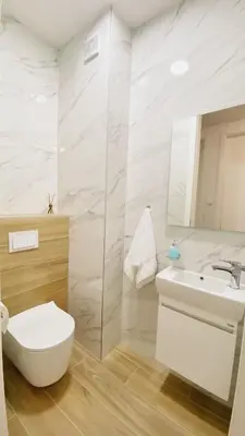 a white bathroom with a toilet and a sink at Park & Play in Banja Luka