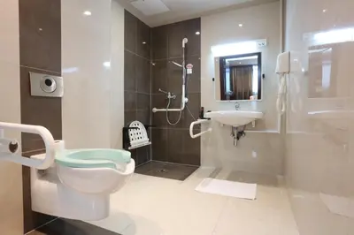 a bathroom with a toilet and a sink at Hotel Zenica in Zenica