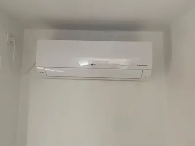 a white object is hanging on a wall at Apartman Downtown in Bosanski Novi