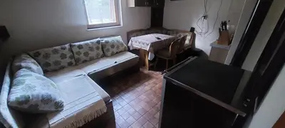 a living room with a couch and a table at Naša Maša Doboj - farma jelena Nasa Masa Doboj in Doboj