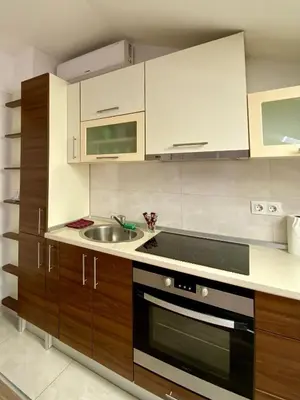 a kitchen with a sink and a stove top oven at Skylight studio Banja Luka in Banja Luka