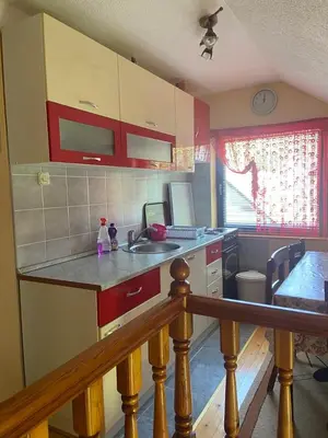 a kitchen with a sink and a counter top at Apartman Zeko in Kupres