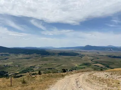 a dirt road on the side of a hill at Apartman Zeko in Kupres