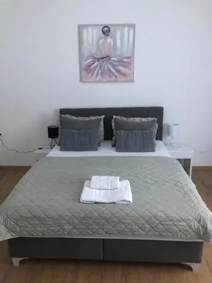 a bedroom with a bed with a white towel on it at Graciaa in Jajce