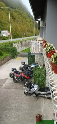a group of motorcycles parked outside of a building at Graciaa in Jajce