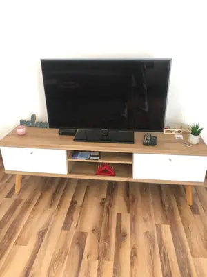 a flat screen tv sitting on top of a entertainment center at Graciaa in Jajce