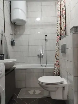 a bathroom with a toilet and a sink and a shower at Apartman Green City with garage in Banja Luka