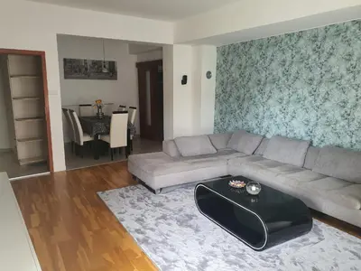 a living room with a couch and a table at Iva Lux stan na dan in Banja Luka