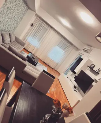 an overhead view of a living room with a couch and a table at Iva Lux stan na dan in Banja Luka