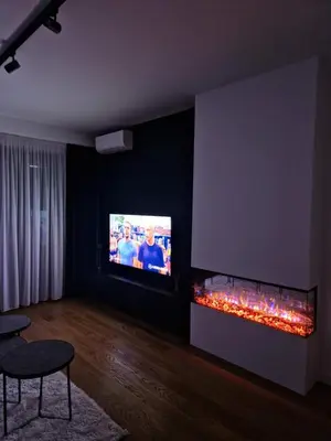 a living room with a tv and a fire place at TOMAS LUX APARTMENTS in Banja Luka