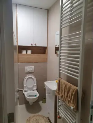 a small bathroom with a toilet and a sink at ApartmanM&M in Banja Luka