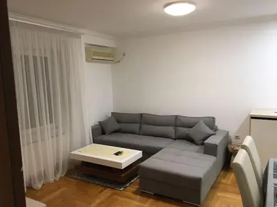 a living room with a couch and a coffee table at Apartman DeLUX in Banja Luka