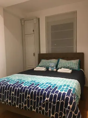 a bedroom with a bed with two pillows on it at Apartman DeLUX in Banja Luka