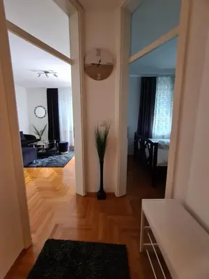a living room with a vase with a plant in it at Apartman Mirjana in Banja Luka
