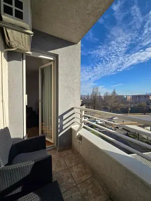 a balcony of a building with two chairs on it at Apartman Mirjana in Banja Luka