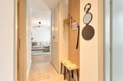 a hallway with a small bench next to a wall at Green Oasis in Banja Luka