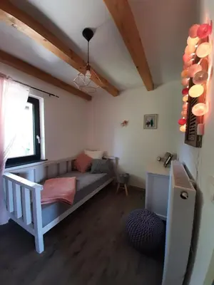 a living room with a couch and a window at House Na Starom Kućištu in Todorovo