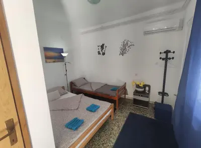 a small room with a bed and a couch at Apartmani Nova Topola in Nova Topola