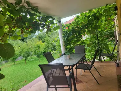 a table and chairs sitting on a patio at Apartman D&D 1 in Jajce