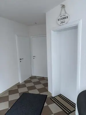 a room with two closets and a door with a rug at Apartman D&D 2 in Jajce
