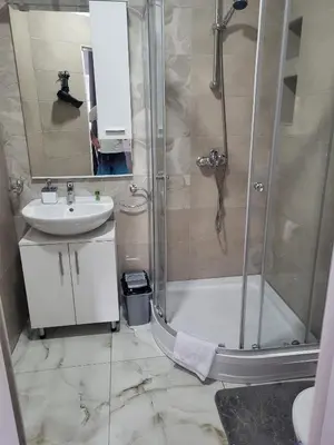 a bathroom with a shower and a sink at Apartman D&D 2 in Jajce