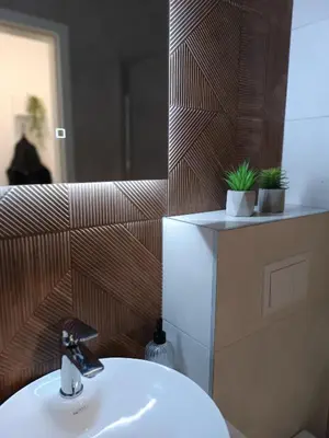 a bathroom with a sink and a mirror at Apartman Vista Banja Luka in Banja Luka