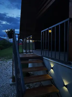 a staircase with lights on the side of a building at Lake House Beliz in Livno