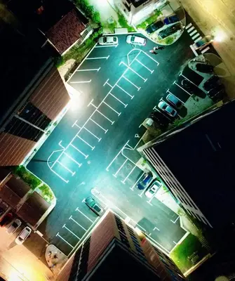 an aerial view of a parking lot at night at Apartman Harmani in Bihać