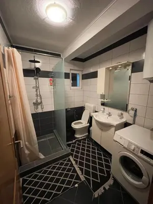 a bathroom with a sink and a toilet and a shower at Unique Una in Ripač