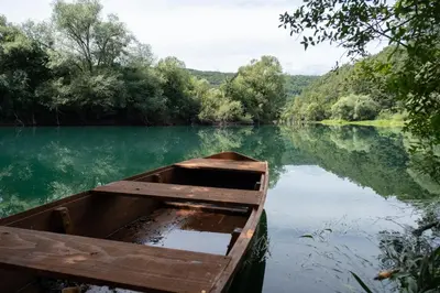 a wooden boat in the middle of a lake at Greenoasis Bihac in Bihać