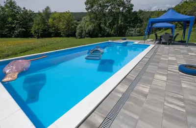 a swimming pool with a gazebo and a swimming pool at Greenoasis Bihac in Bihać