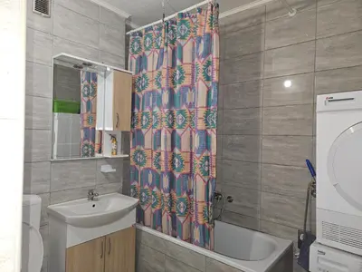 a bathroom with a sink and a shower curtain at Meri in Jajce