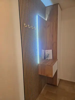 a room with a wooden partition with a light on it at Golden Sky in Cazin