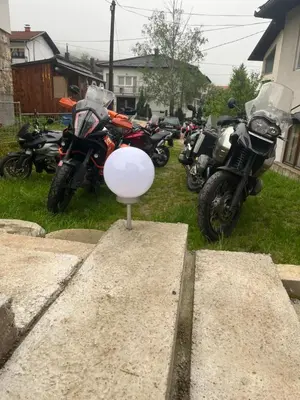 a bunch of motorcycles are parked in a yard at Vito apartments in Jajce