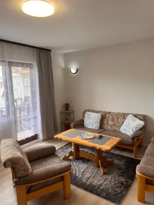 a living room with a couch and a table at Vito apartments in Jajce