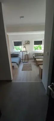 a living room with a couch and a table at Apartman Jakša in Prijedor
