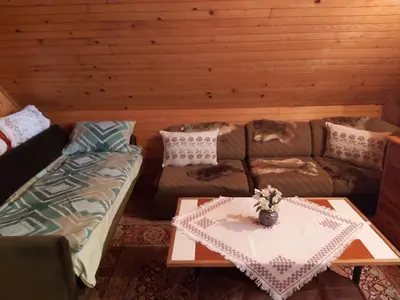 a living room with a couch and a table at Vikendica odmor za dusu in Visoko